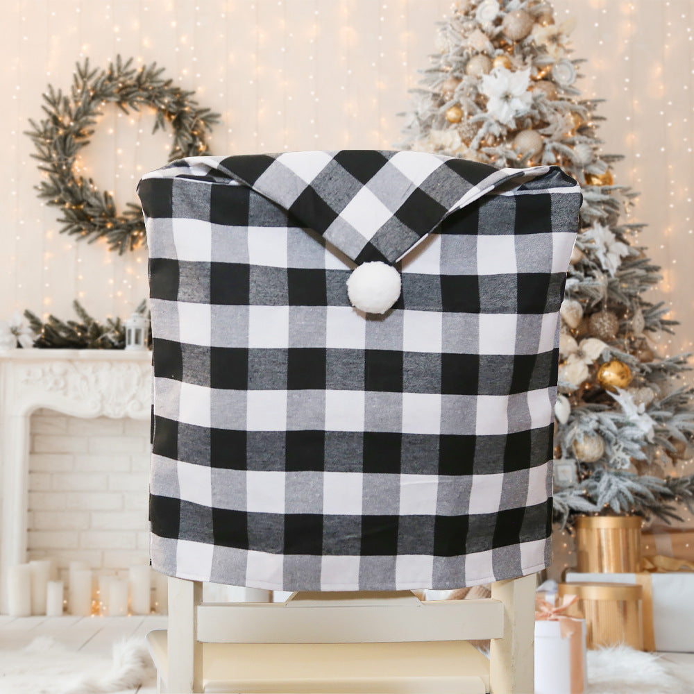 New home decor items for Christmas season, featuring red and black checkered patterns with white fur balls. Chair covers for Christmas atmosphere decoration